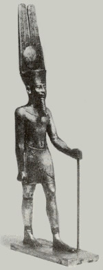 Statue of Amon with crown of sun disk and plumes.